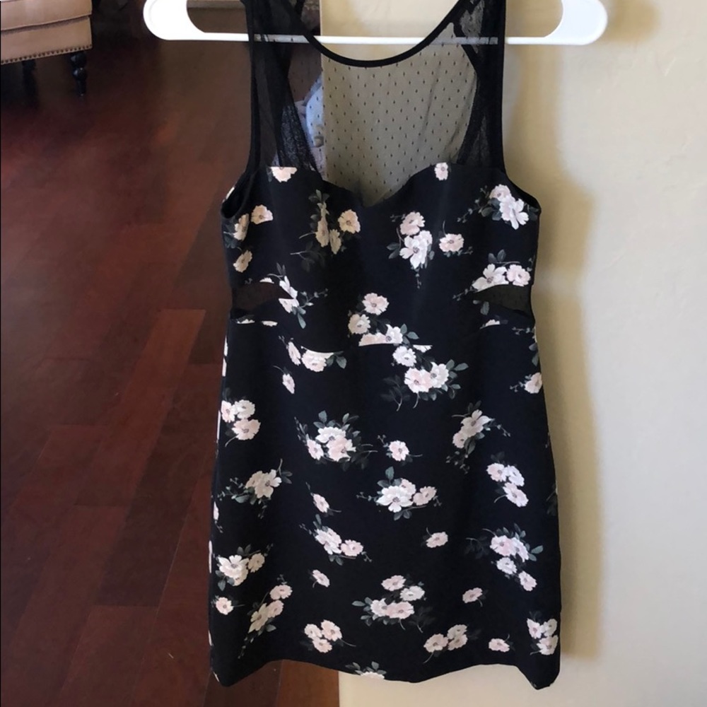 Black floral express mini dress with lace cutouts